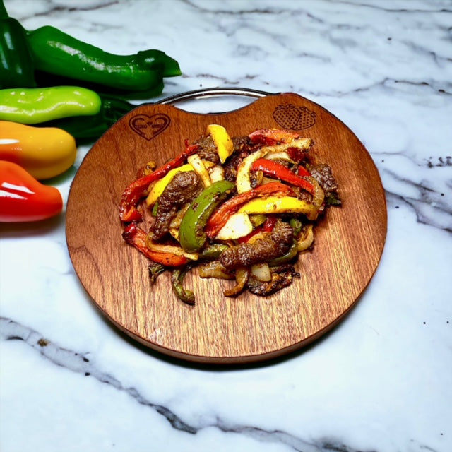Fervor4Flavor's Ebony Wood Round Cutting Board with Stainless Steel Handle: Stylishly versatile. Perfect for cheeses, meats, crackers, and wine.