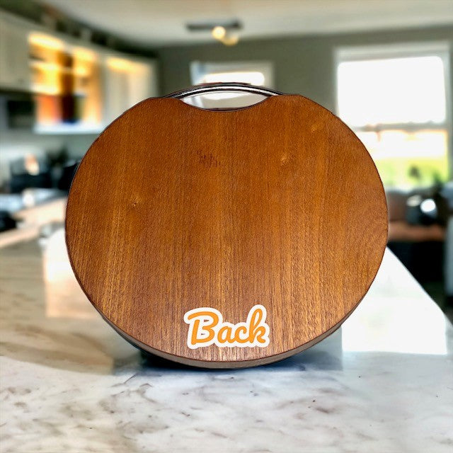 Fervor4Flavor's Ebony Wood Round Cutting Board with Stainless Steel Handle: Stylishly versatile. Perfect for cheeses, meats, crackers, and wine.