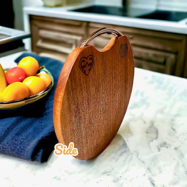 Fervor4Flavor's Ebony Wood Round Cutting Board with Stainless Steel Handle: Stylishly versatile. Perfect for cheeses, meats, crackers, and wine.