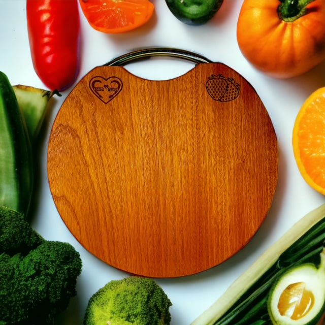 Fervor4Flavor's Ebony Wood Round Cutting Board with Stainless Steel Handle: Stylishly versatile. Perfect for cheeses, meats, crackers, and wine.
